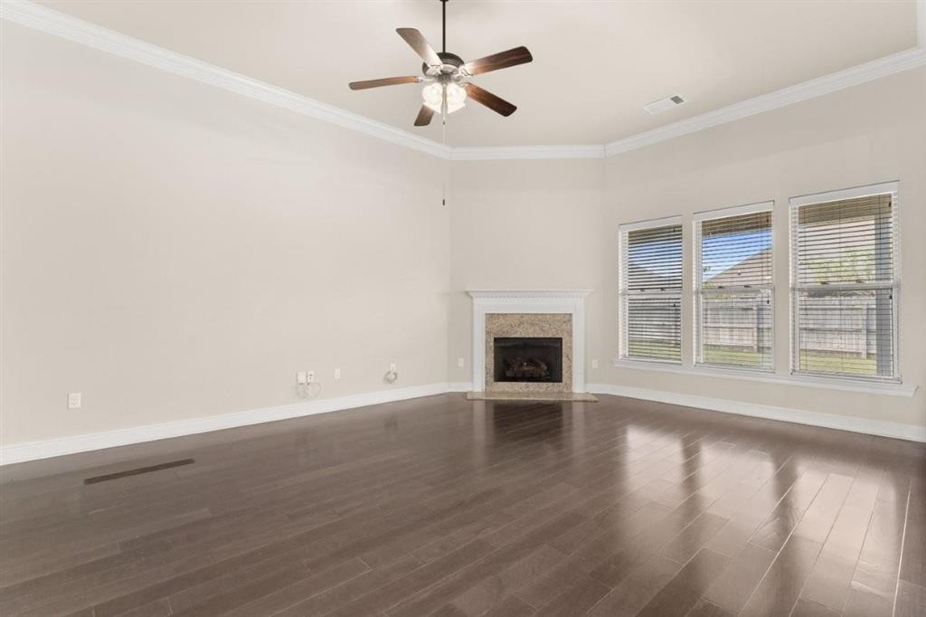 1923 Thibodeaux Road Lake Charles, LA 70607 - Photo 4 of 29 The view of this photo shows the ceiling to floor windows that overlook the privacy fenced yard.