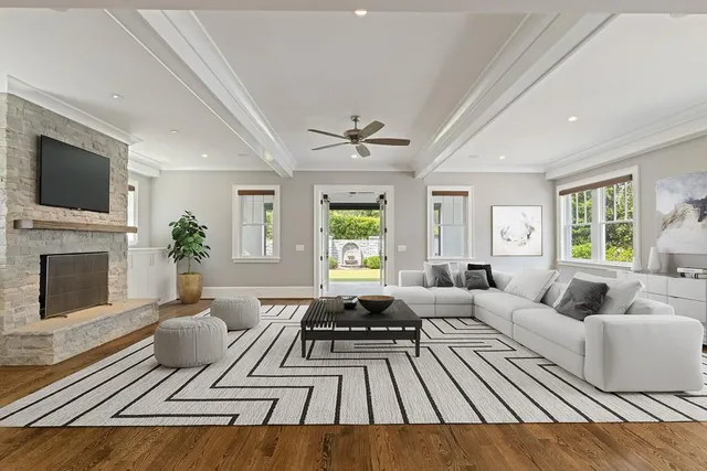 a living room with furniture fireplace and flat screen tv