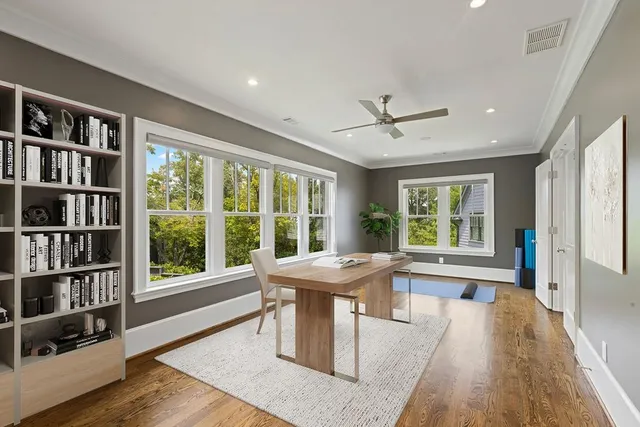 a dining room with furniture and a book shelf