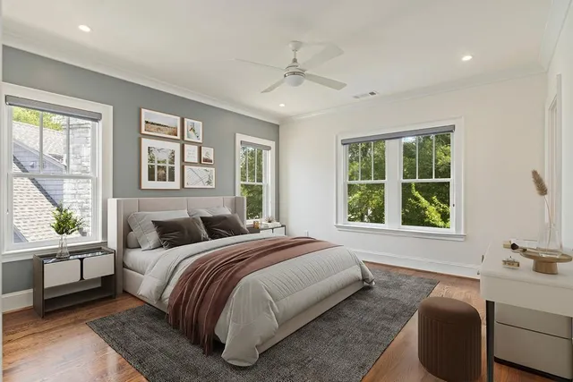 a bedroom with a bed and a window