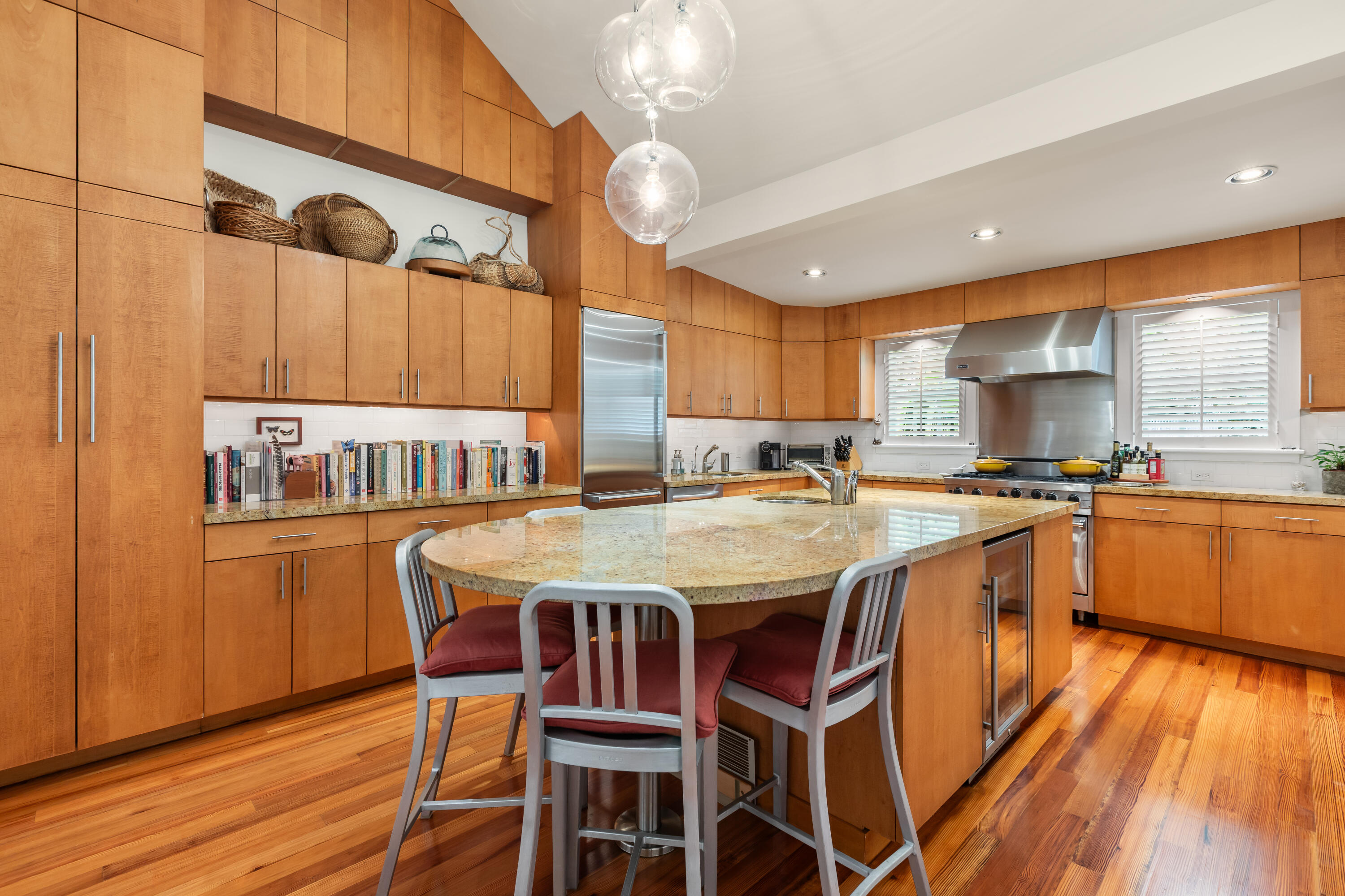 910-914 Watson Street Key West, FL 33040 - Photo 24 of 38 a kitchen with stainless steel appliances granite countertop a sink and wooden floors