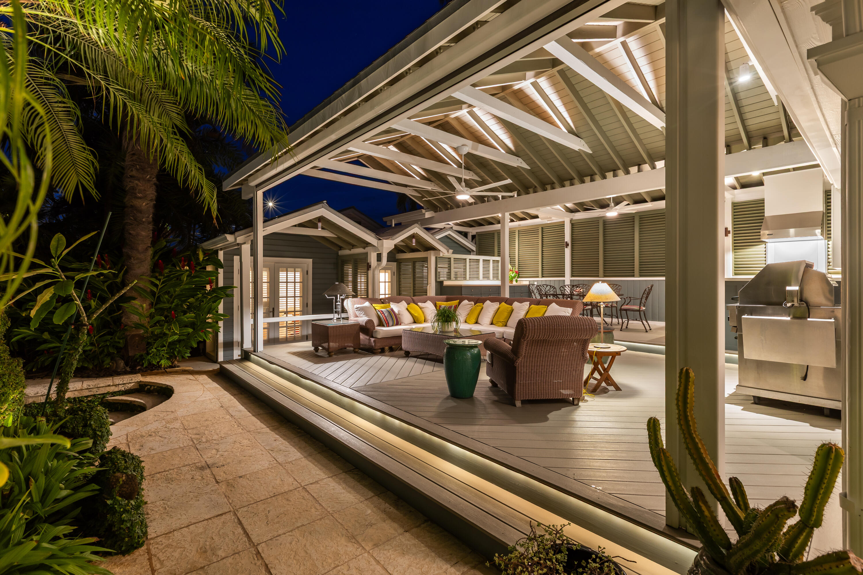 910-914 Watson Street Key West, FL 33040 - Photo 27 of 38 a view of a patio with dining table and chairs with a couches and potted plants