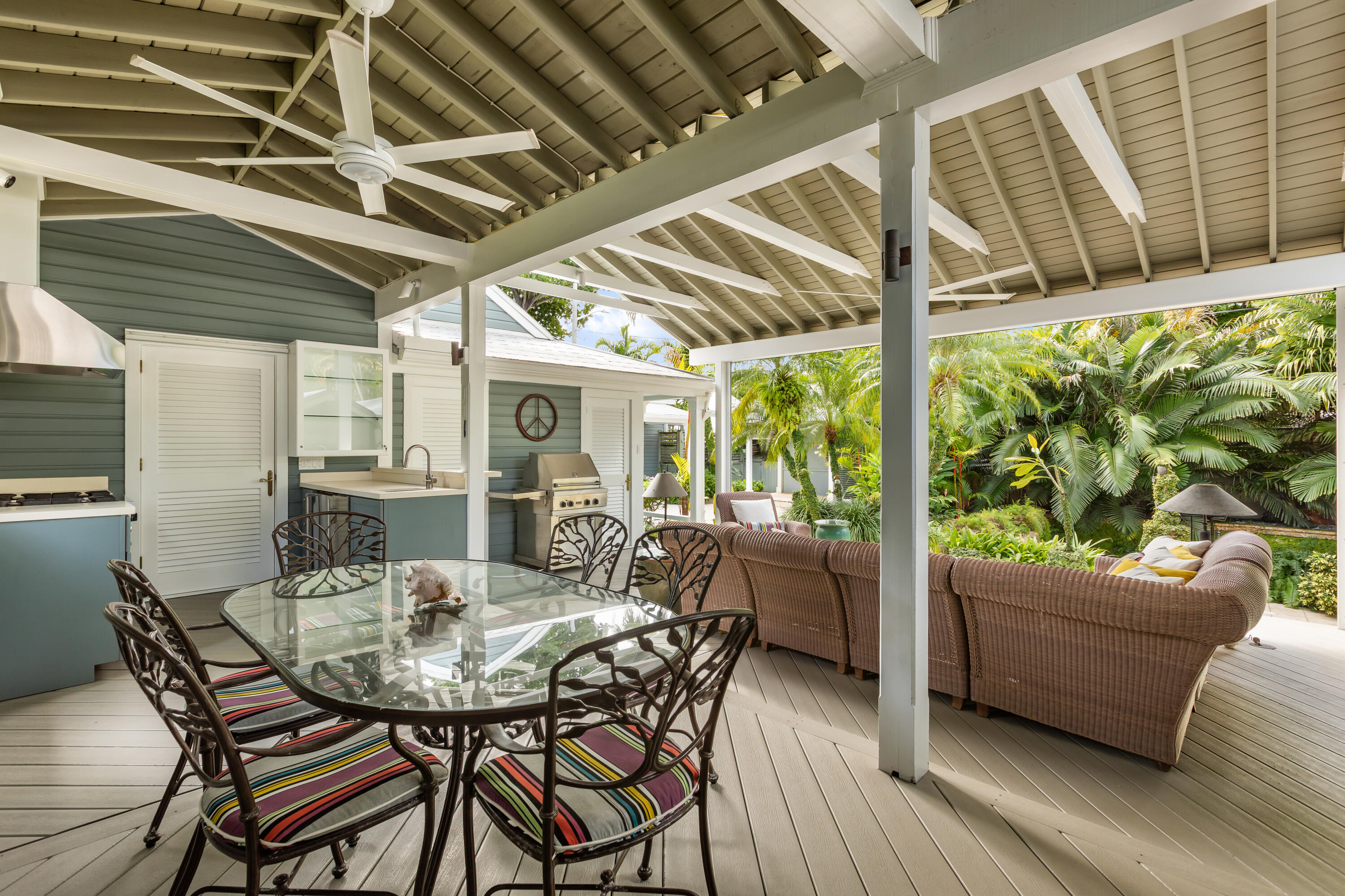 910-914 Watson Street Key West, FL 33040 - Photo 29 of 38 a view of a patio with table and chairs and potted plants