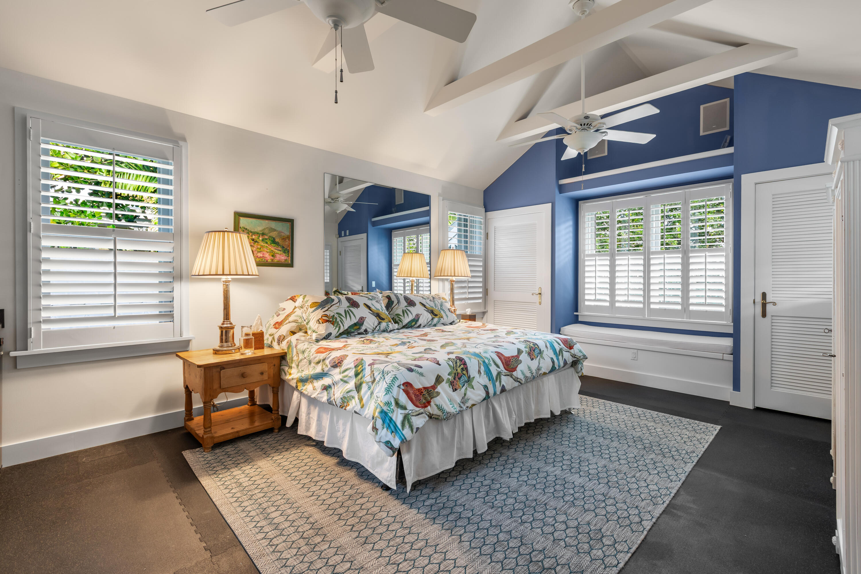 910-914 Watson Street Key West, FL 33040 - Photo 34 of 38 a bedroom with a bed lamp and a large window