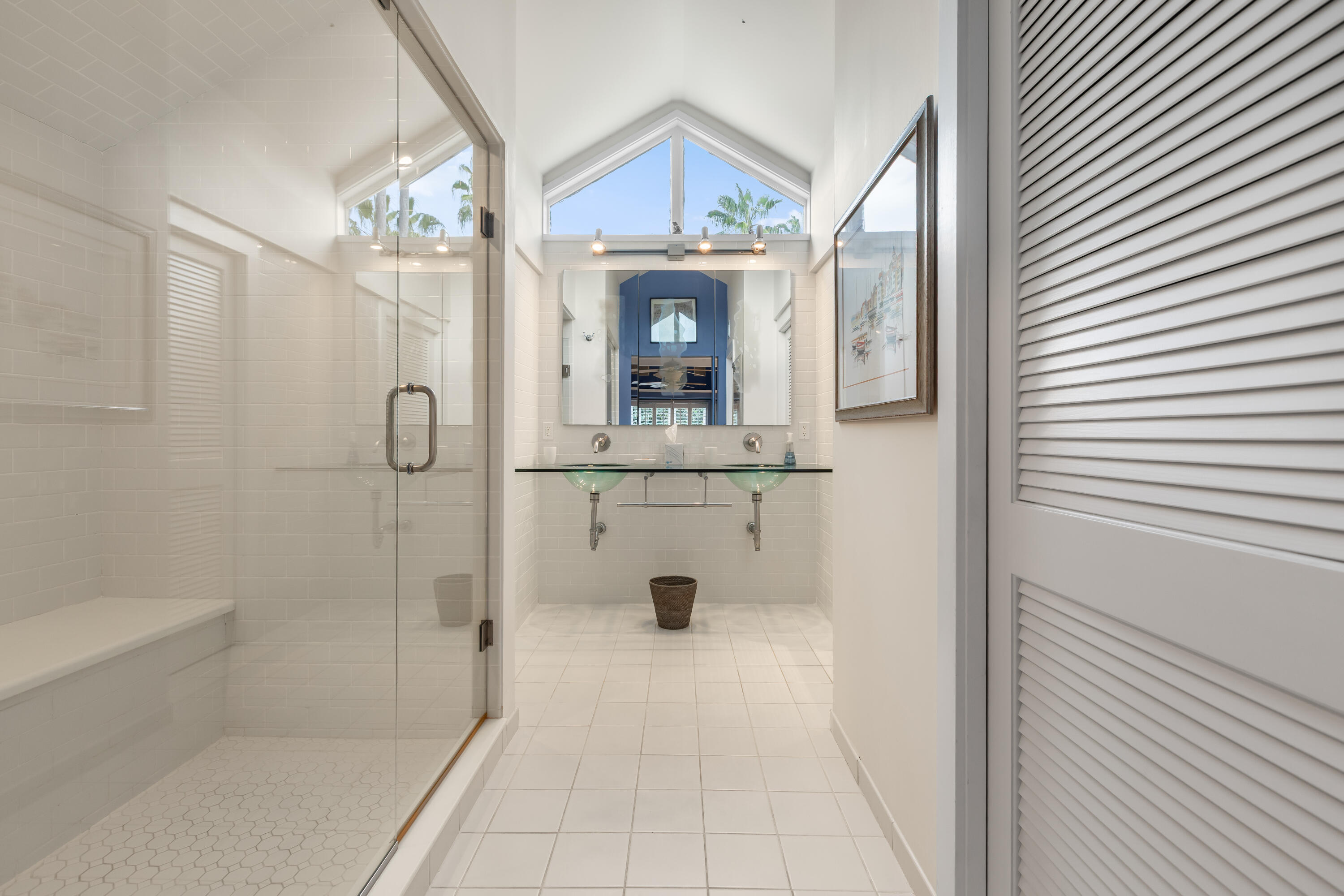 910-914 Watson Street Key West, FL 33040 - Photo 35 of 38 a bathroom with a sink a mirror and a shower