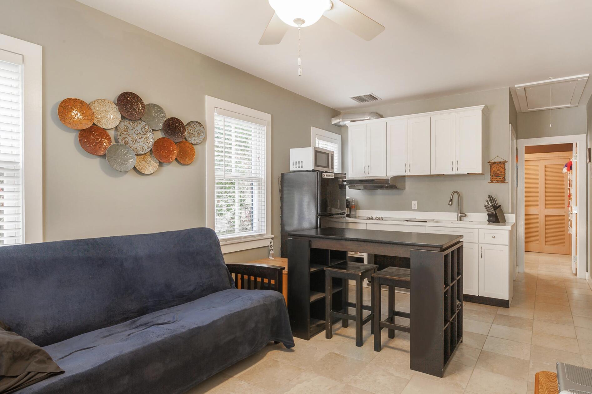 910-914 Watson Street Key West, FL 33040 - Photo 38 of 38 a living room with granite countertop furniture and a window