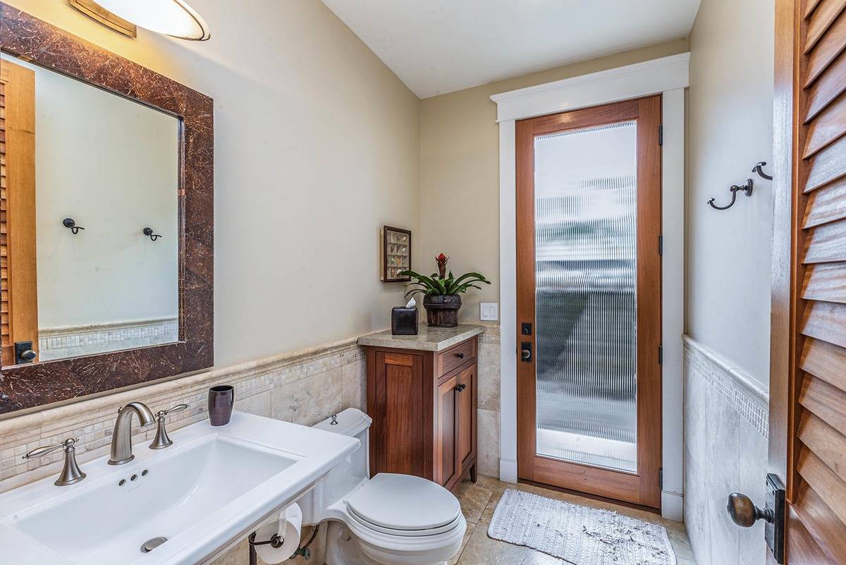 5070 Kukuna Road Kilauea, HI 96754 - Photo 22 of 30 a bathroom with a sink a toilet and shower