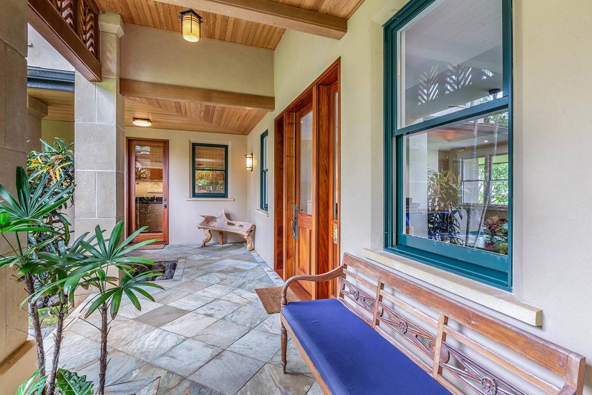 5070 Kukuna Road Kilauea, HI 96754 - Photo 5 of 30 a living room filled with furniture and a potted plant