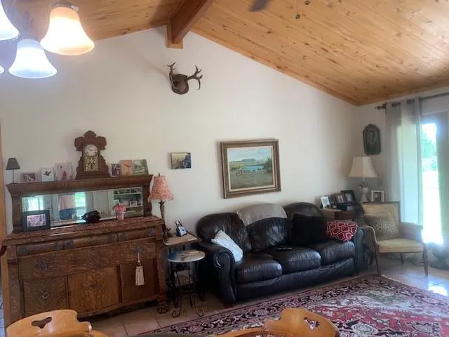 a bedroom with a bed and two windows