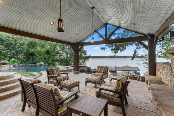 a view of a patio with a table and chairs