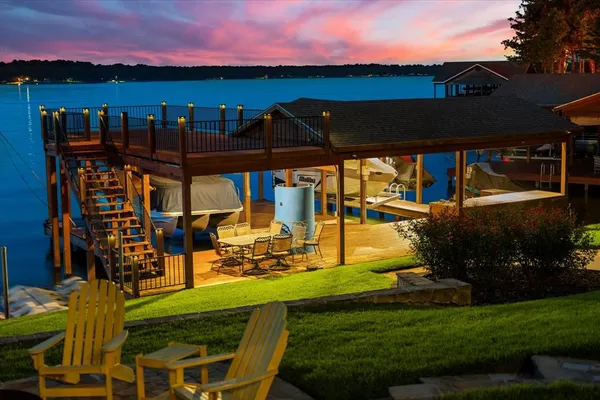 aerial view of a house with a yard balcony and a patio