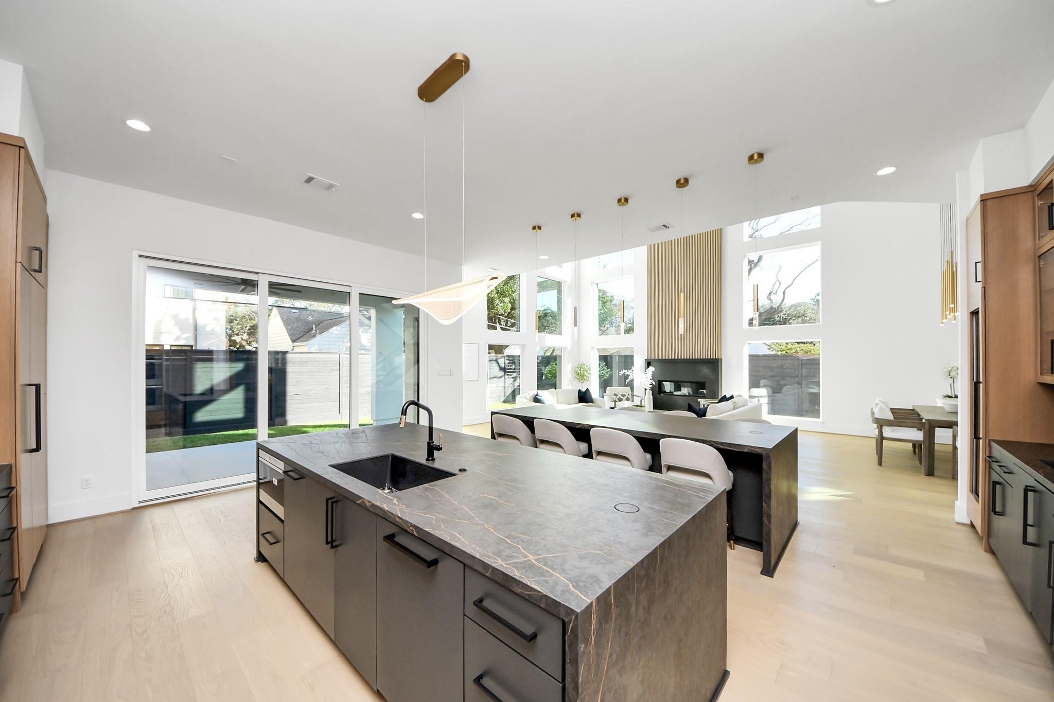 2232 Swift Boulevard Houston, TX 77030 - Photo 13 of 46 Oversized island with seating, pendant lighting, and ample prep space.