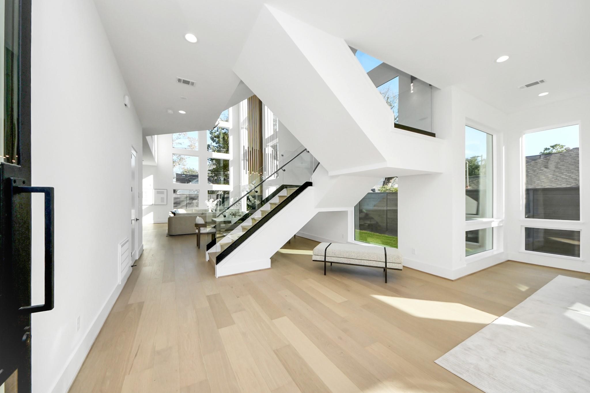 2232 Swift Boulevard Houston, TX 77030 - Photo 2 of 46 Light-filled entry showcasing open-concept layout and modern architectural details.