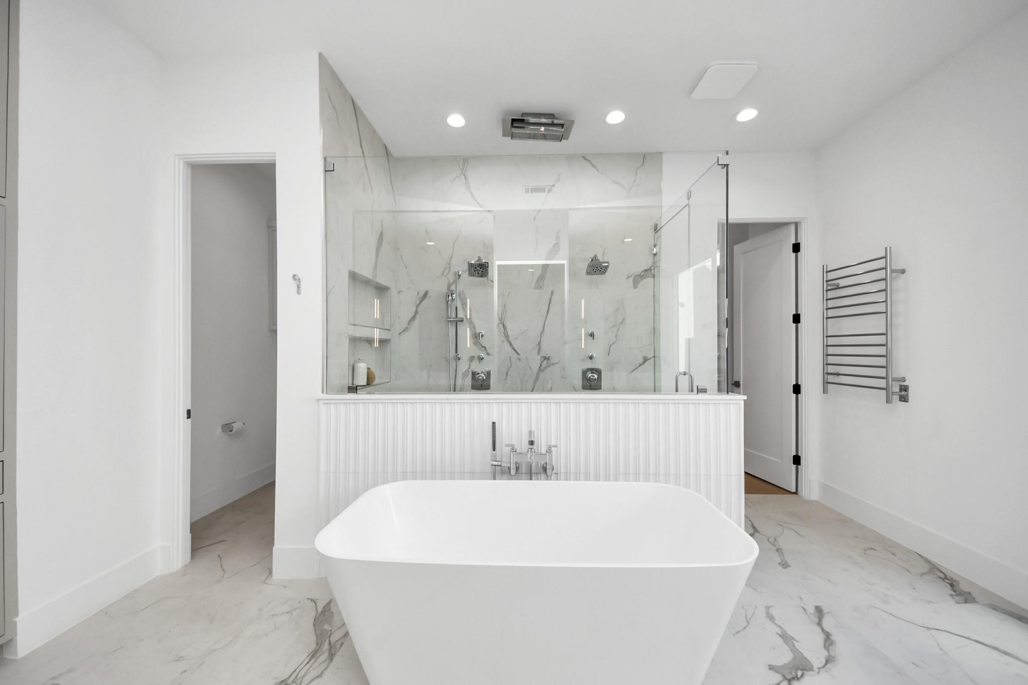 2232 Swift Boulevard Houston, TX 77030 - Photo 23 of 46 Spa-style primary bath with freestanding soaking tub, oversized shower, and double vanities.