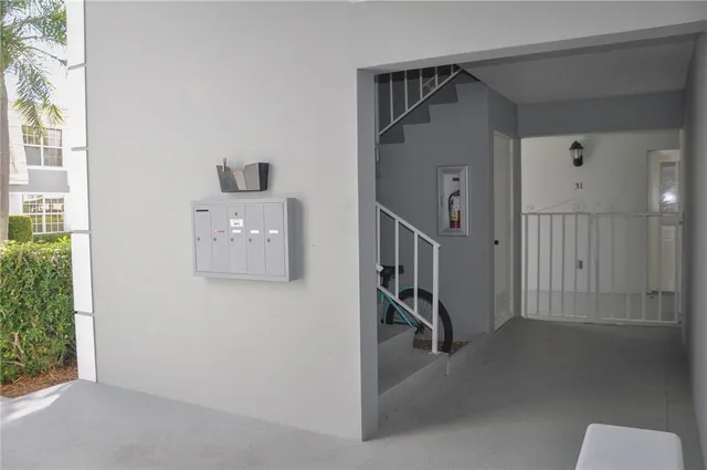 a view of entryway and hall with a front door