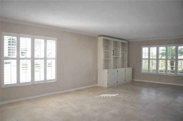 an empty room with windows