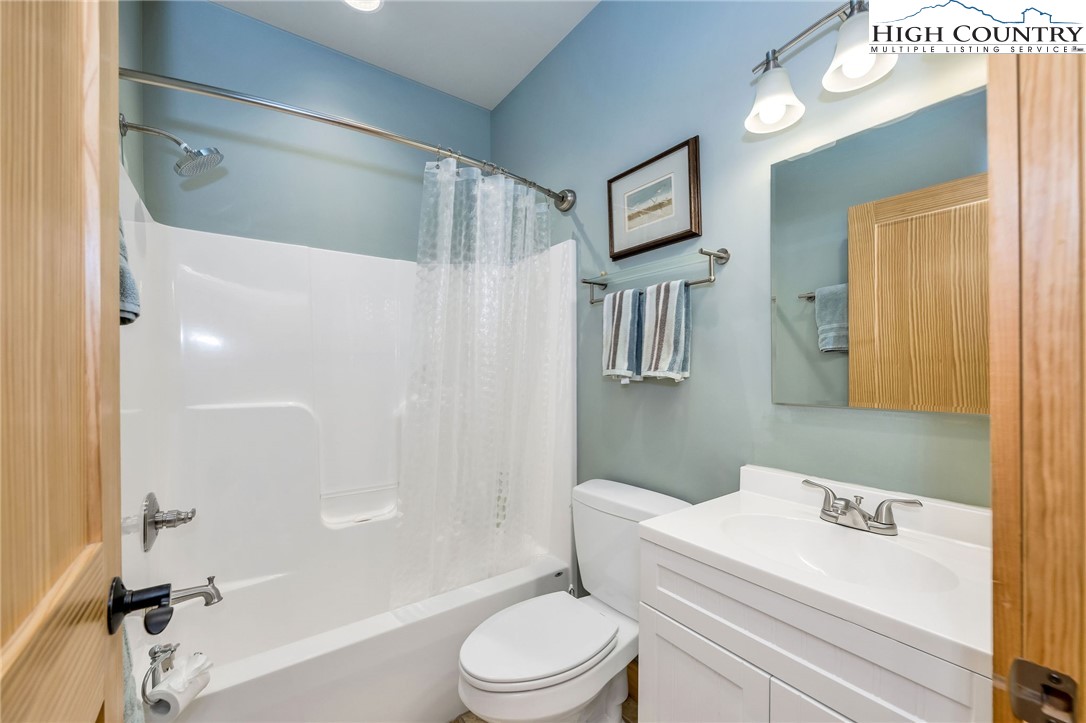 1976 Hartzog Ford Road West Jefferson, NC 28694 - Photo 13 of 50 a white toilet sitting next to a bathroom sink