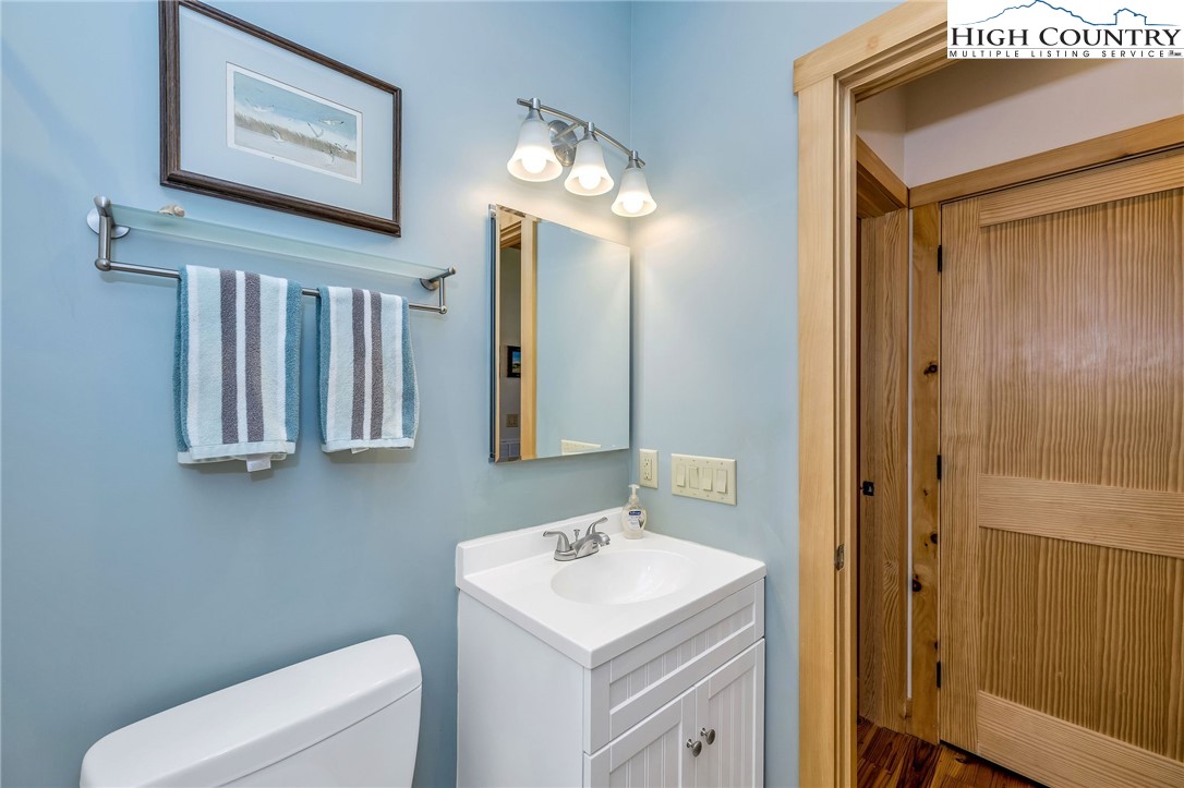 1976 Hartzog Ford Road West Jefferson, NC 28694 - Photo 14 of 50 a bathroom with a toilet sink and mirror