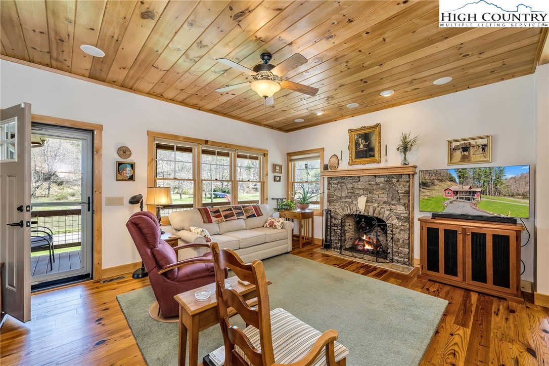 1976 Hartzog Ford Road West Jefferson, NC 28694 - Photo 21 of 50 a living room with furniture and a fireplace