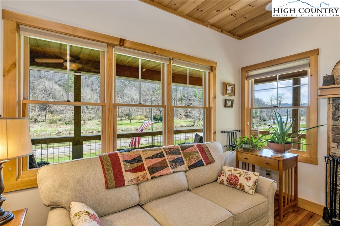 1976 Hartzog Ford Road West Jefferson, NC 28694 - Photo 22 of 50 a living room with furniture and a large window
