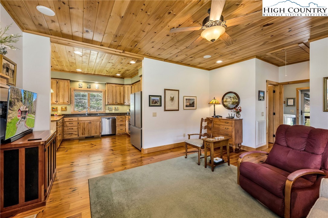 1976 Hartzog Ford Road West Jefferson, NC 28694 - Photo 23 of 50 a living room with furniture and a chandelier