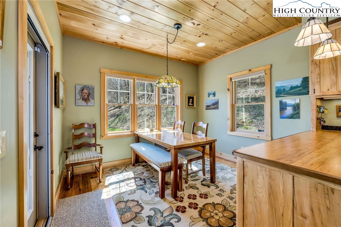 1976 Hartzog Ford Road West Jefferson, NC 28694 - Photo 31 of 50 a living room with furniture and wooden floor