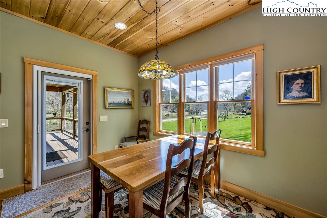 1976 Hartzog Ford Road West Jefferson, NC 28694 - Photo 34 of 50 a view of a dining room with furniture window and outside view