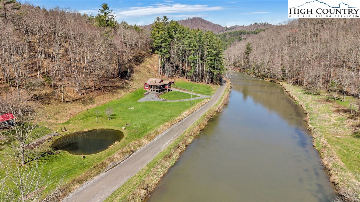 1976 Hartzog Ford Road West Jefferson, NC 28694 - Photo 4 of 50 a view of a swimming pool with a yard