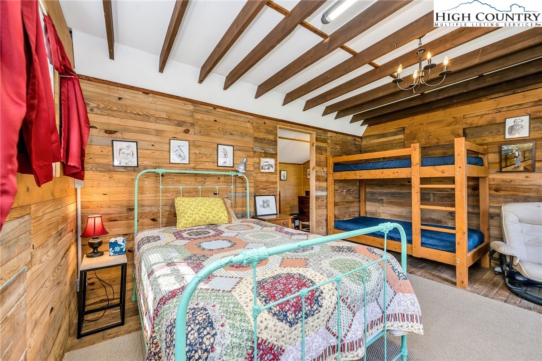 1976 Hartzog Ford Road West Jefferson, NC 28694 - Photo 44 of 50 a bedroom with a bed a standing and a closet