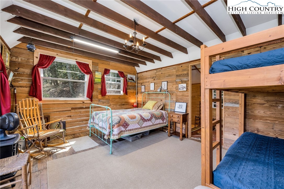 1976 Hartzog Ford Road West Jefferson, NC 28694 - Photo 45 of 50 a bedroom with a bed and a window