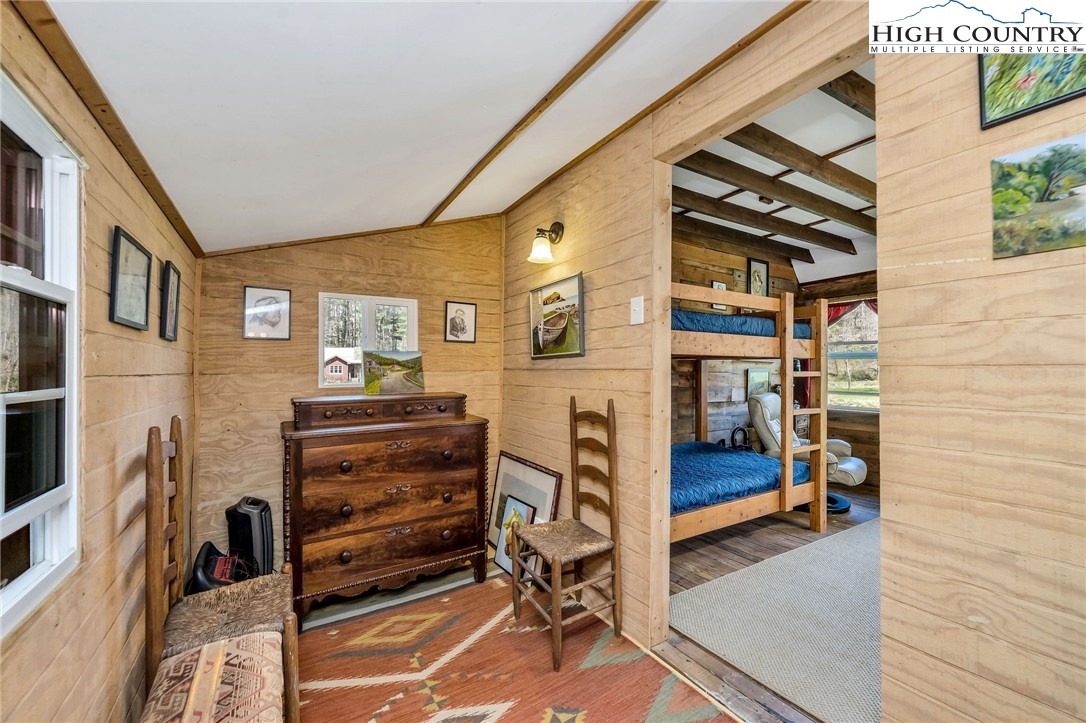 1976 Hartzog Ford Road West Jefferson, NC 28694 - Photo 47 of 50 a view of hall way with furniture and gym equipment