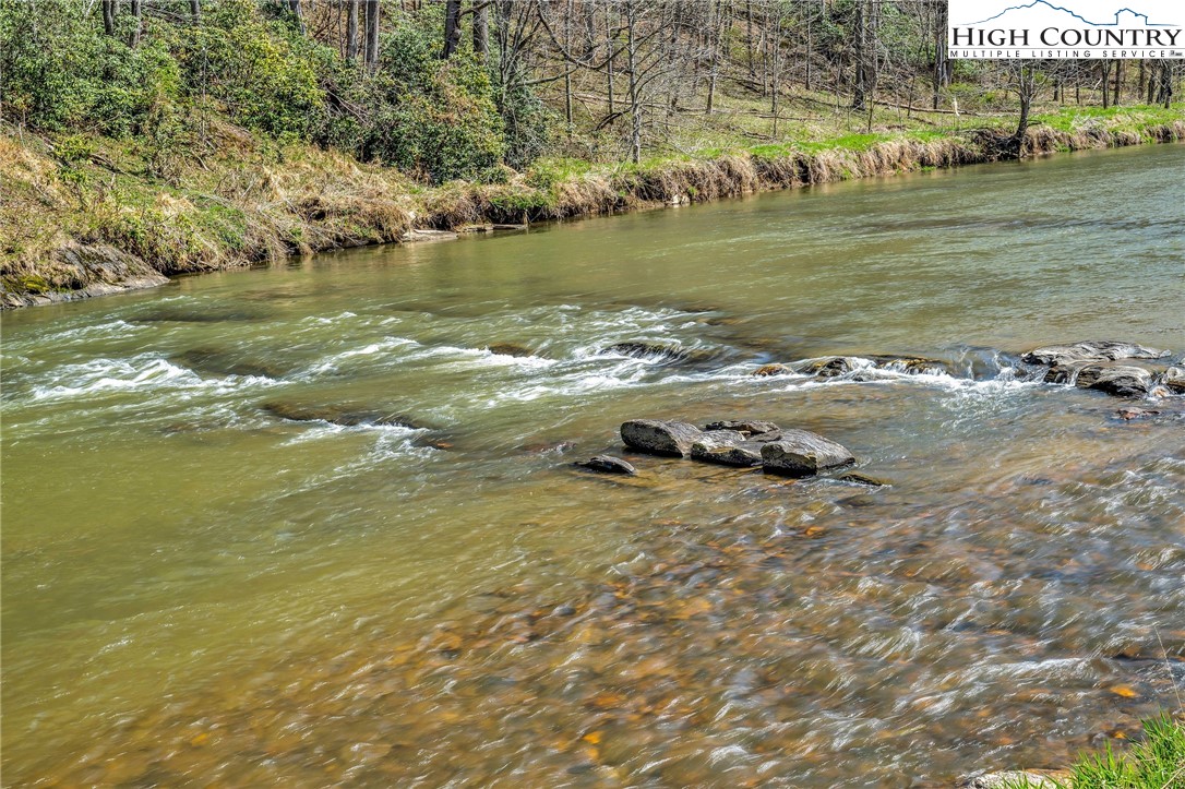 1976 Hartzog Ford Road West Jefferson, NC 28694 - Photo 50 of 50 a view of a lake with houses