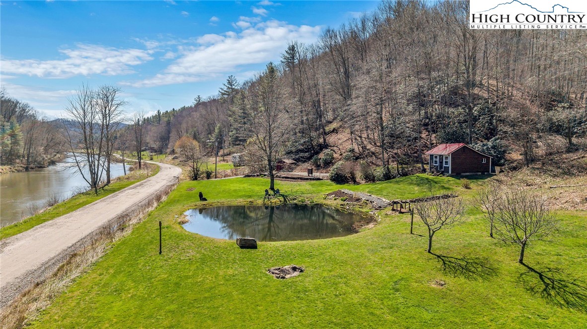 1976 Hartzog Ford Road West Jefferson, NC 28694 - Photo 5 of 50 a view of a swimming pool with a patio