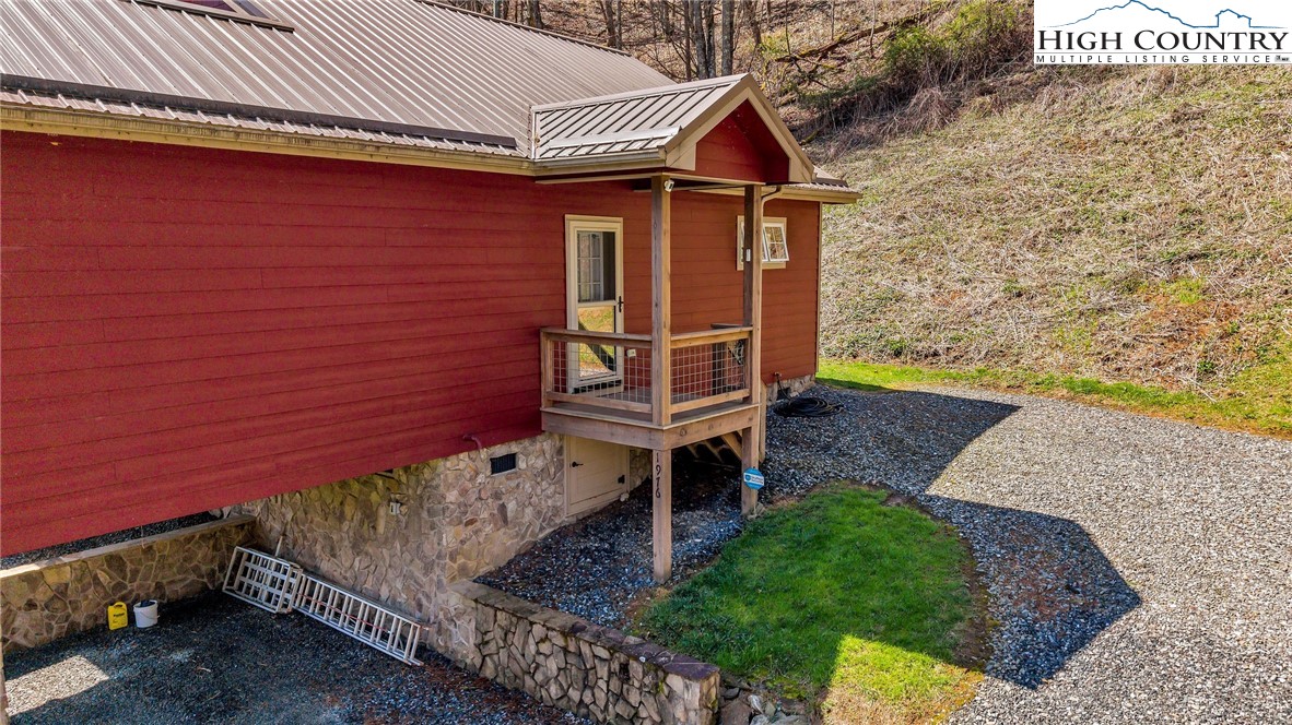 1976 Hartzog Ford Road West Jefferson, NC 28694 - Photo 8 of 50 a front view of a house with garden