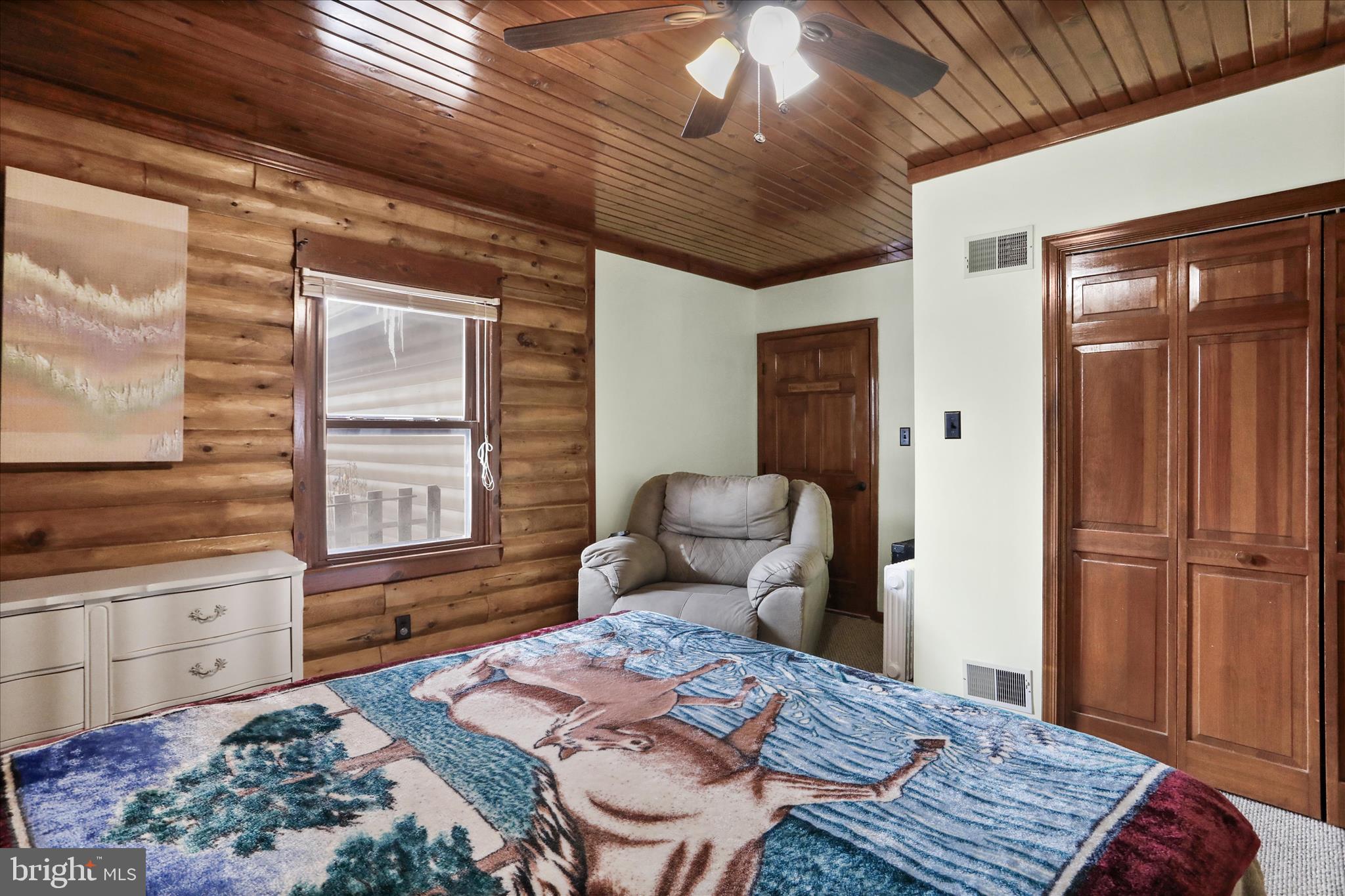 14507 Heavenly Acres Ridge Hancock, MD 21750 - Photo 29 of 70 a bedroom with a bed and wooden floor