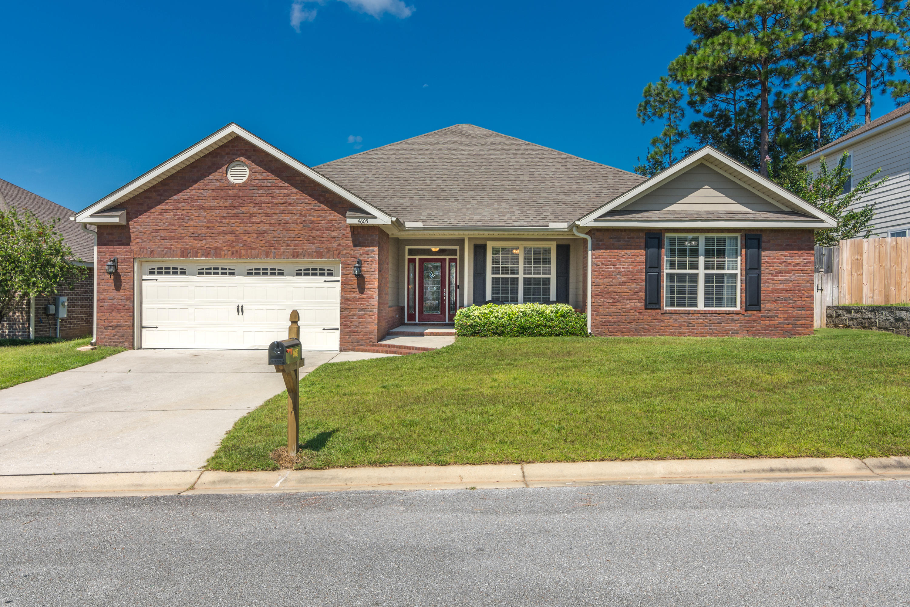 4605 Hermosa Road Crestview, FL 32539 - Photo 1 of 46 a view of a house with a yard and large tree