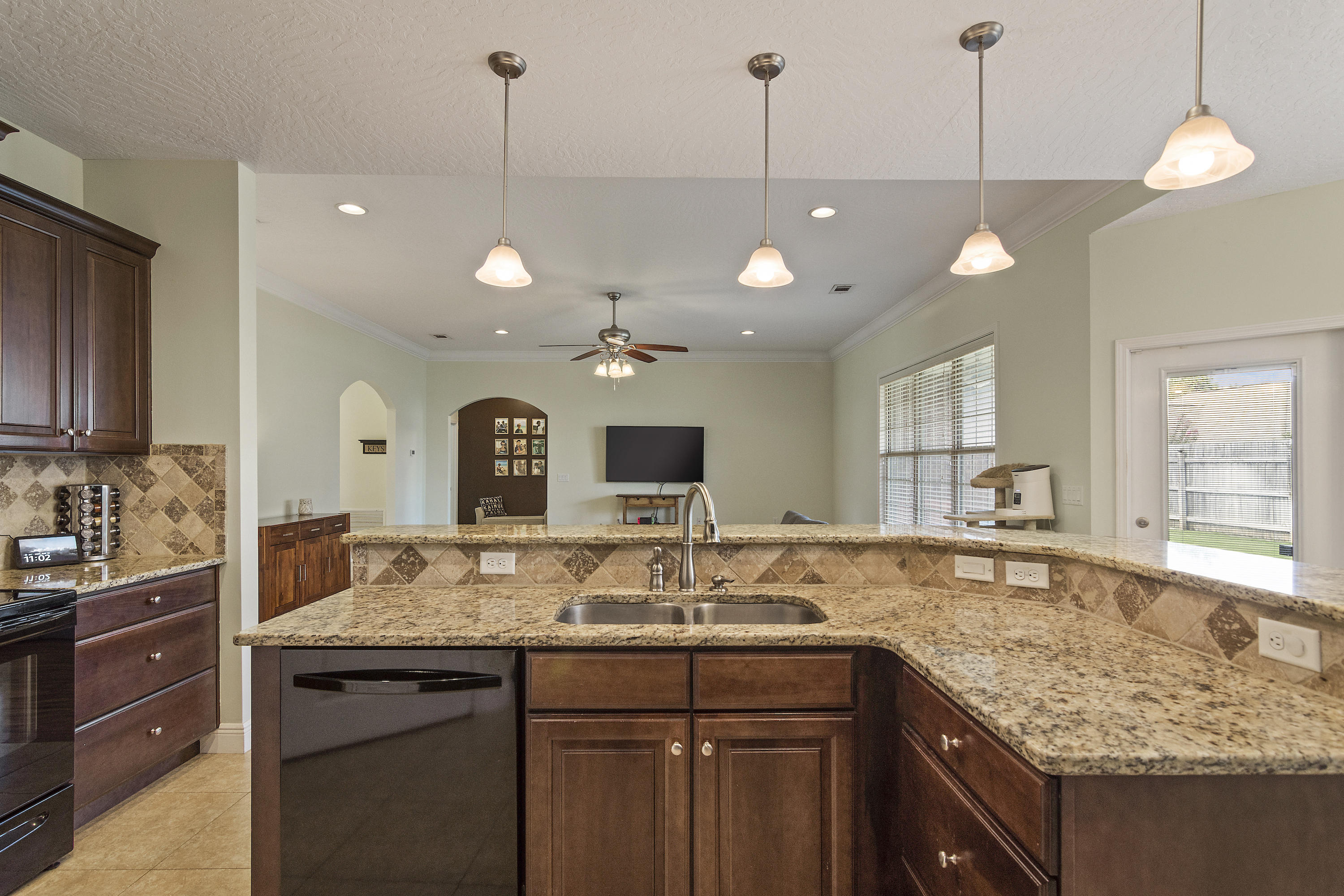 4605 Hermosa Road Crestview, FL 32539 - Photo 20 of 46 a kitchen with center island and a center island