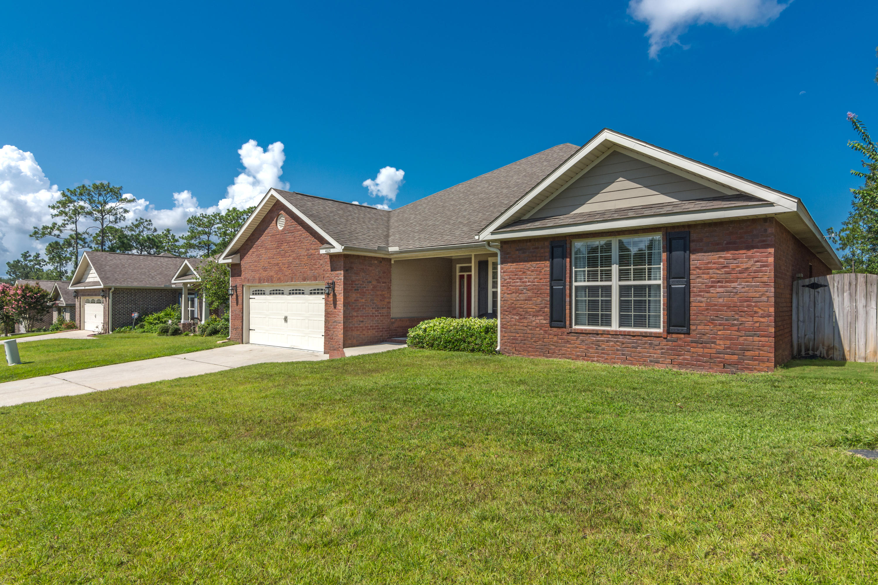 4605 Hermosa Road Crestview, FL 32539 - Photo 3 of 46 a front view of a house with a yard