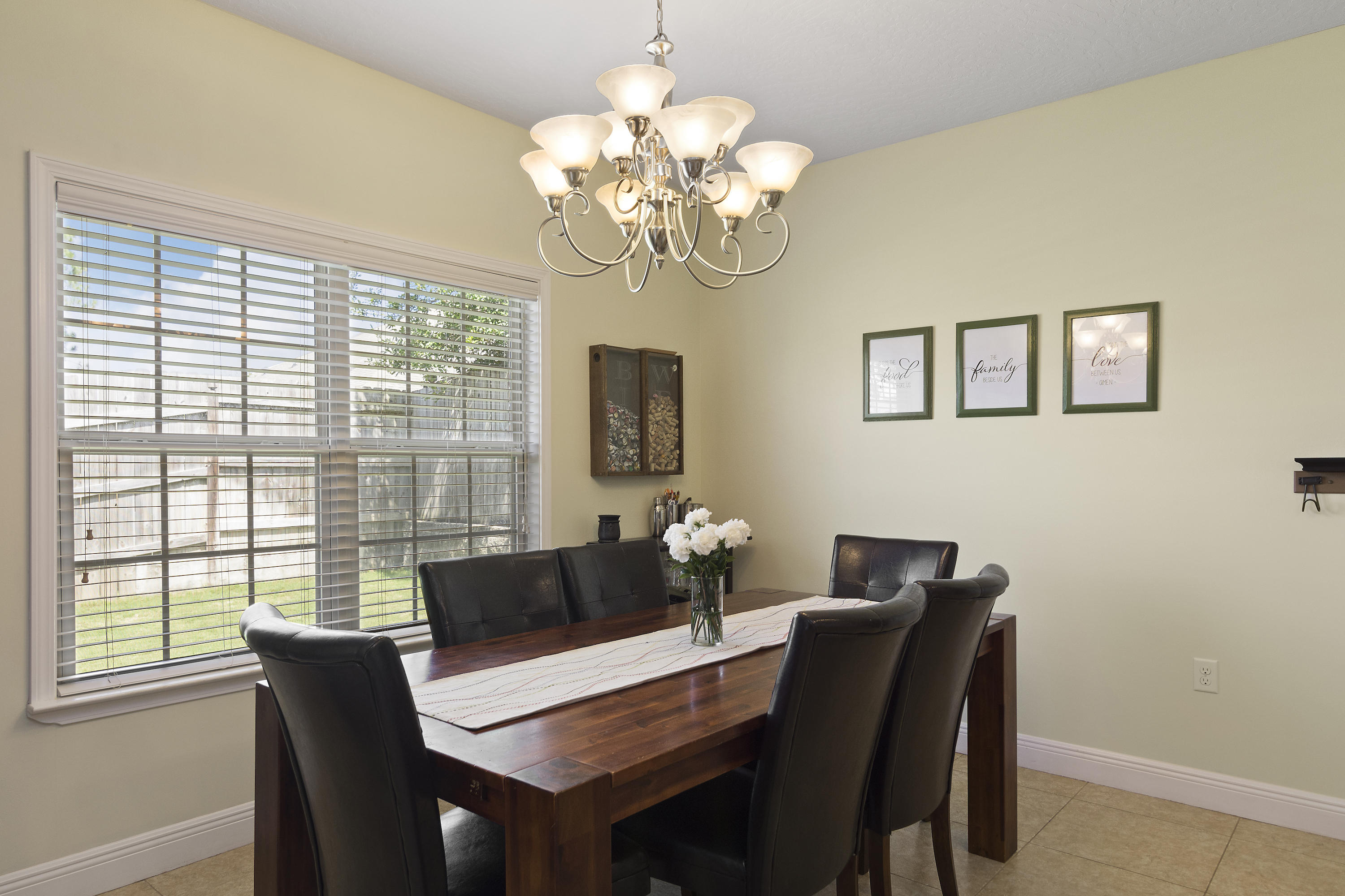 4605 Hermosa Road Crestview, FL 32539 - Photo 23 of 46 a dining room with furniture and window