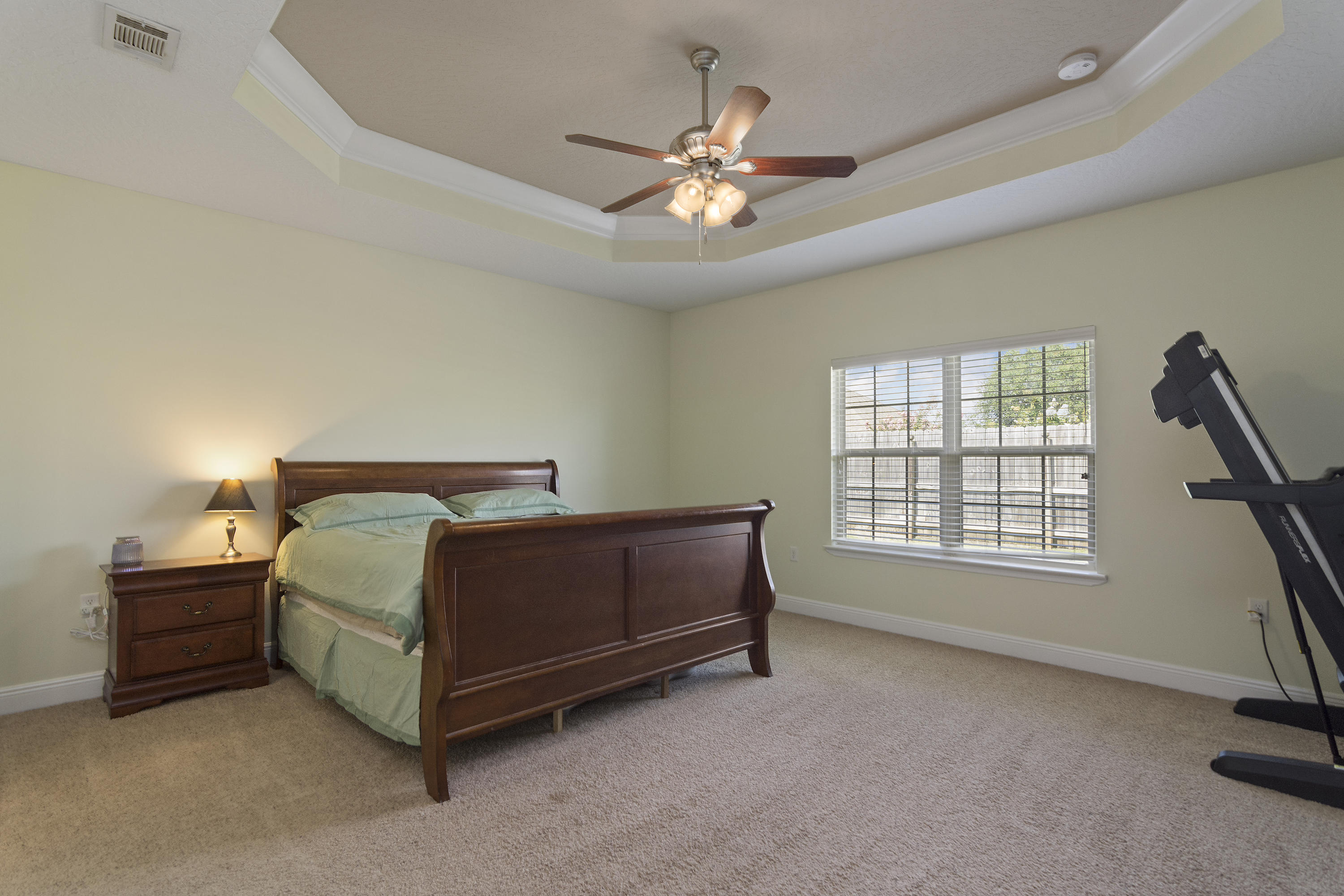 4605 Hermosa Road Crestview, FL 32539 - Photo 24 of 46 a bedroom with a bed and a ceiling fan