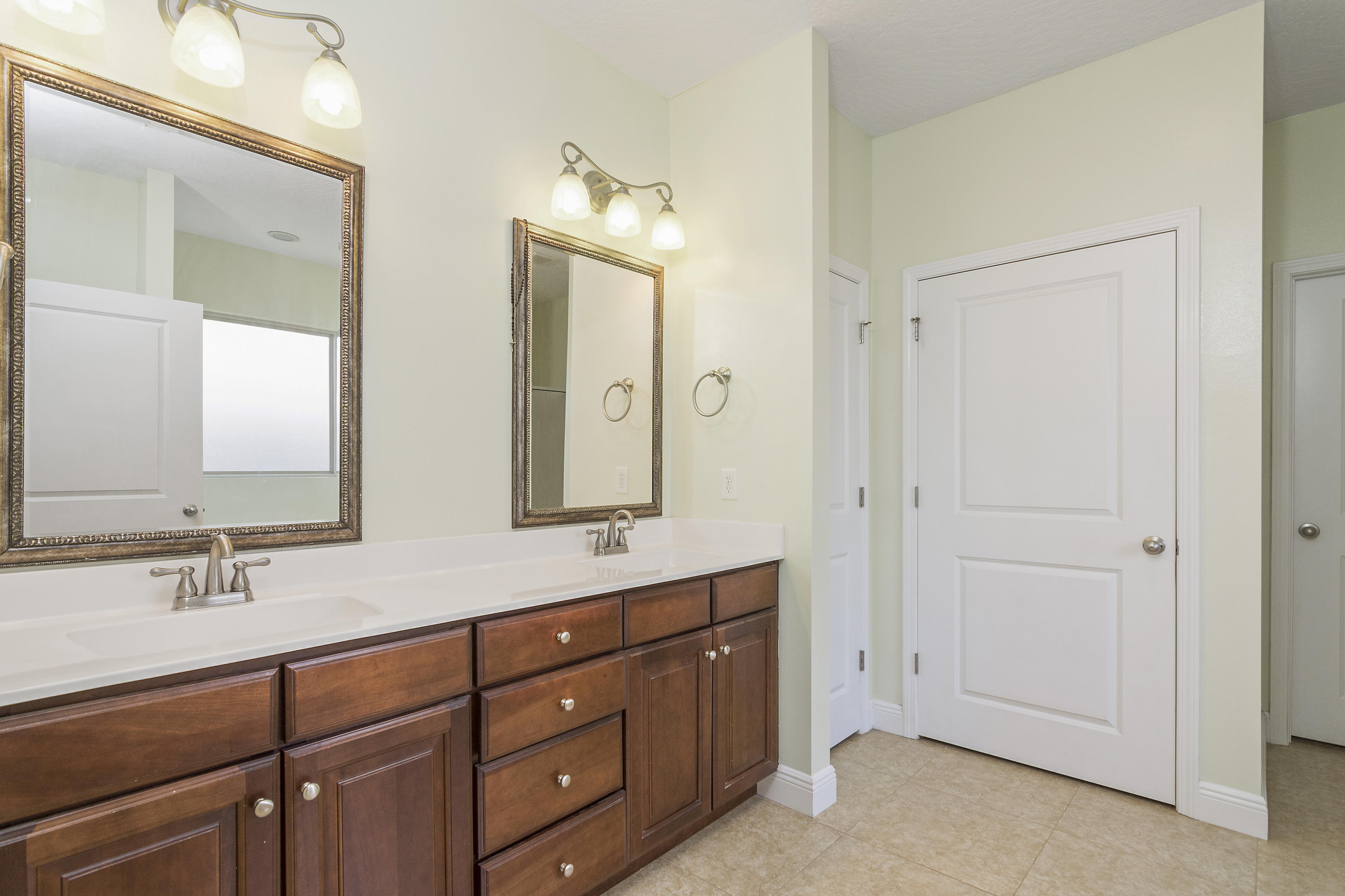 4605 Hermosa Road Crestview, FL 32539 - Photo 26 of 46 a en suite bathroom with double sink and a mirror