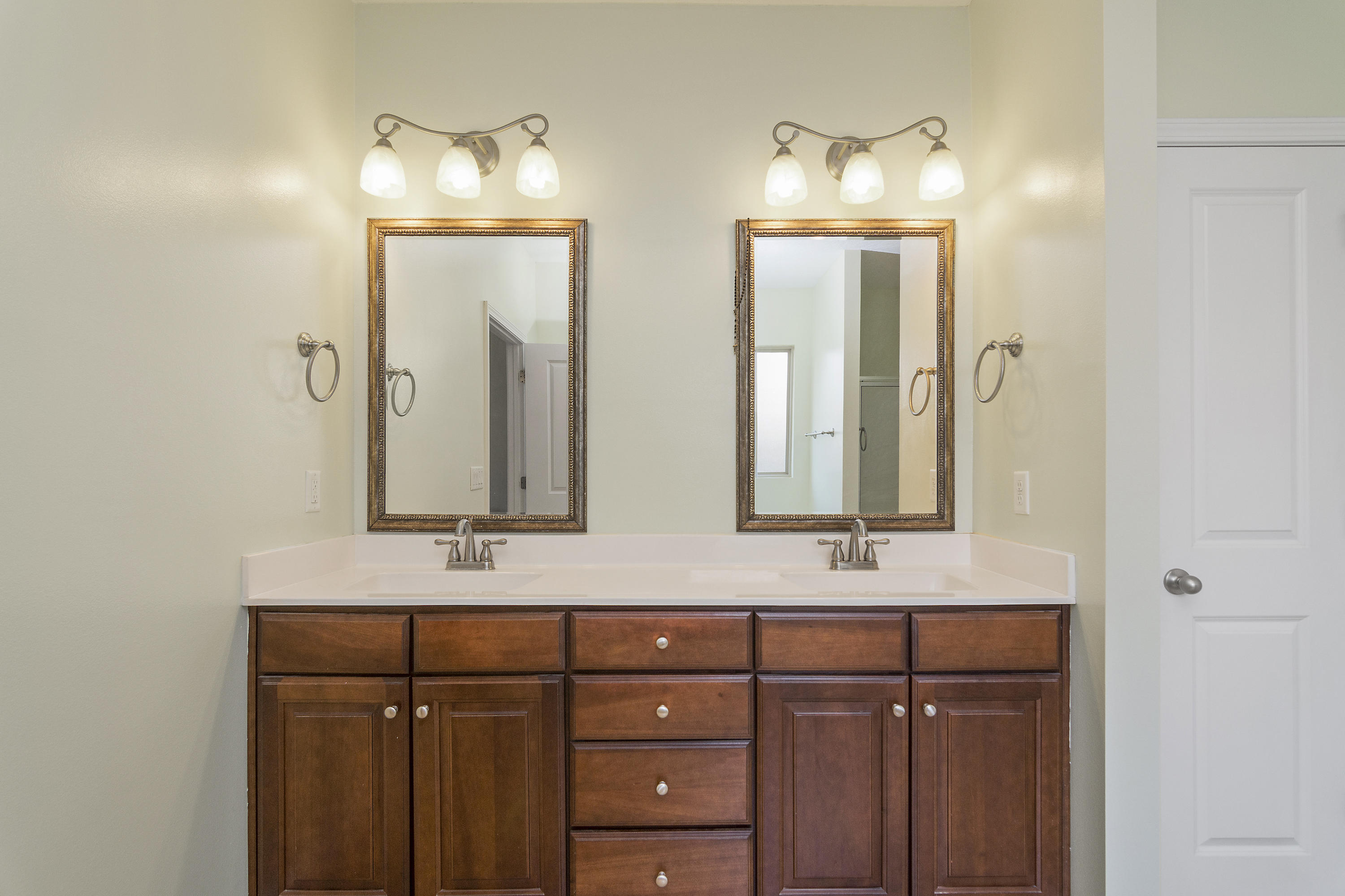 4605 Hermosa Road Crestview, FL 32539 - Photo 27 of 46 a bathroom with a double vanity sink and a mirror