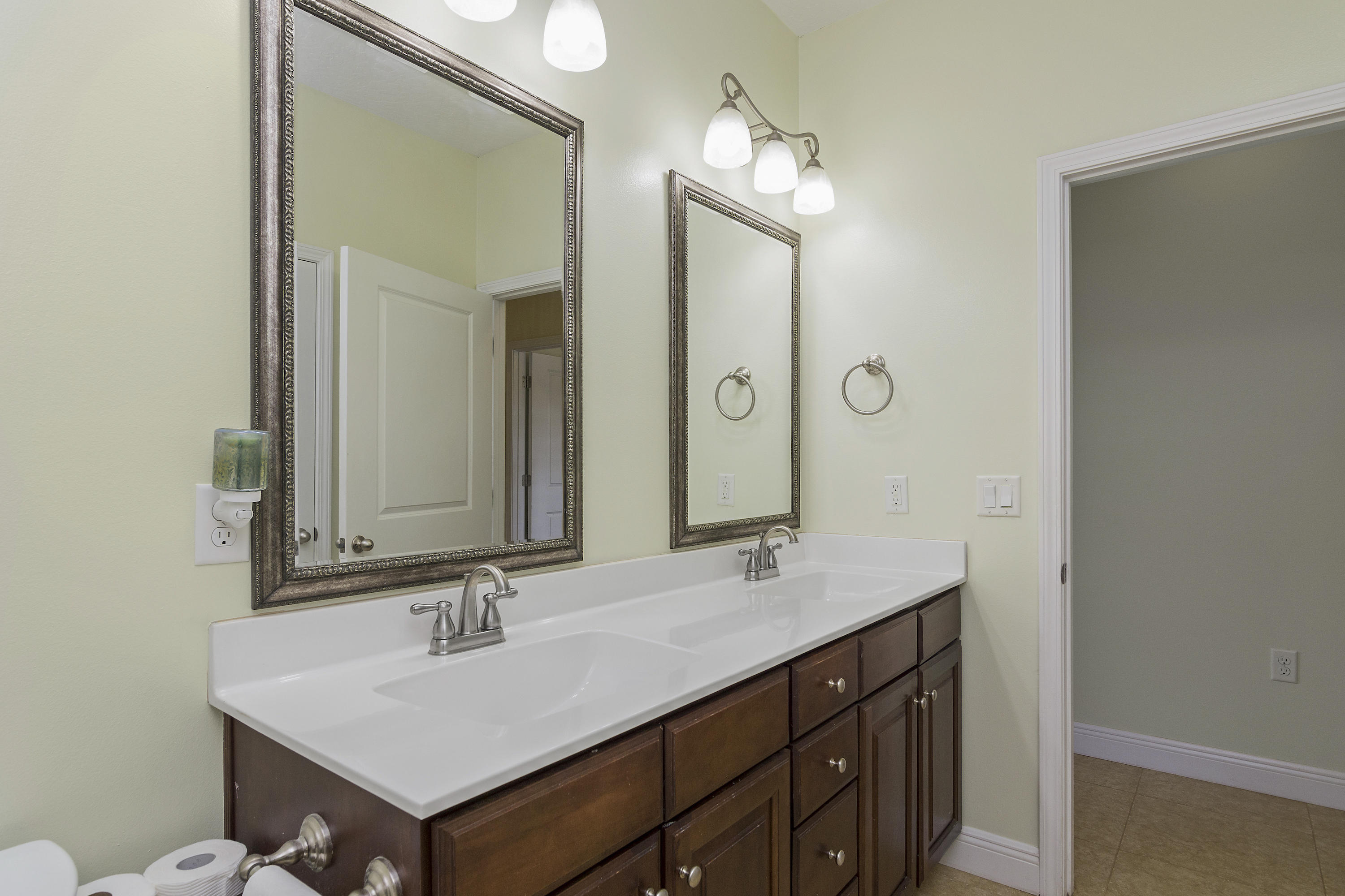4605 Hermosa Road Crestview, FL 32539 - Photo 37 of 46 a bathroom with a sink and a mirror