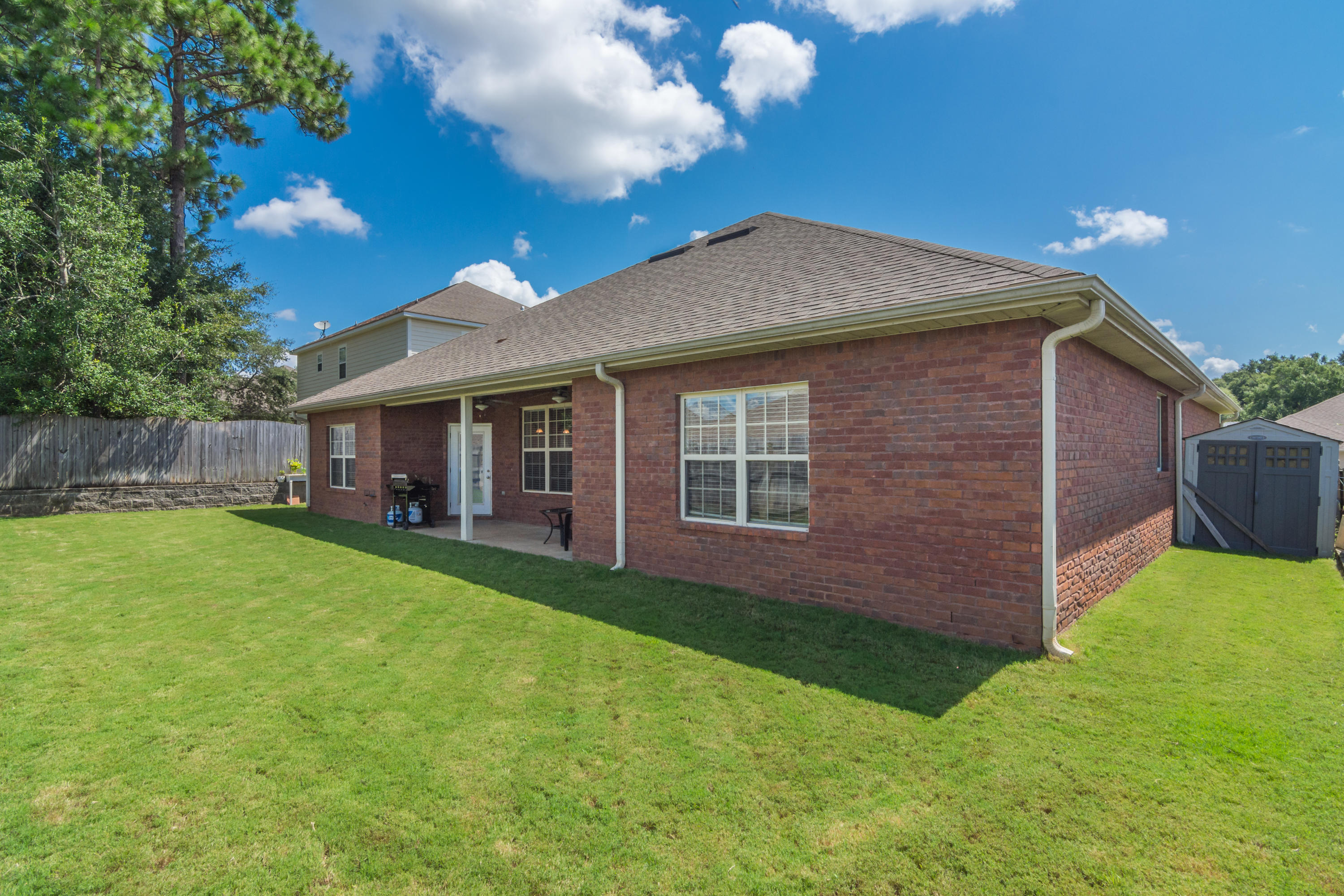 4605 Hermosa Road Crestview, FL 32539 - Photo 8 of 46 a front view of a house with a garden