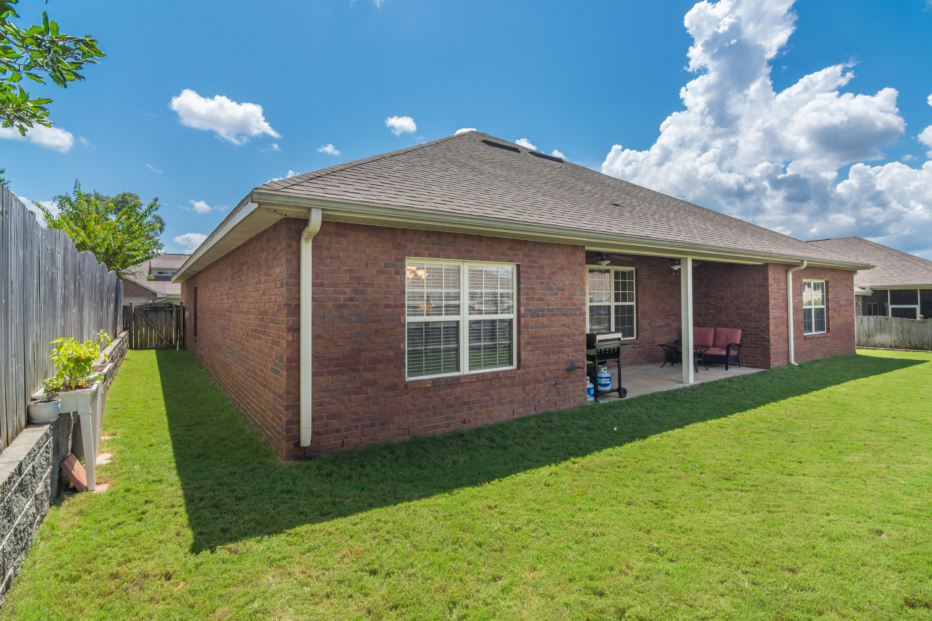 4605 Hermosa Road Crestview, FL 32539 - Photo 9 of 46 a front view of a house with garden
