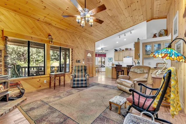 a kitchen with stainless steel appliances granite countertop a sink and a stove