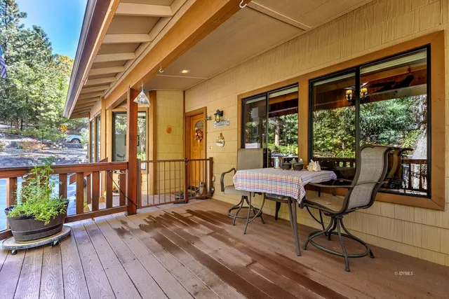 a living room with furniture and a dining area