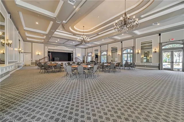 a view of a living room and chandelier