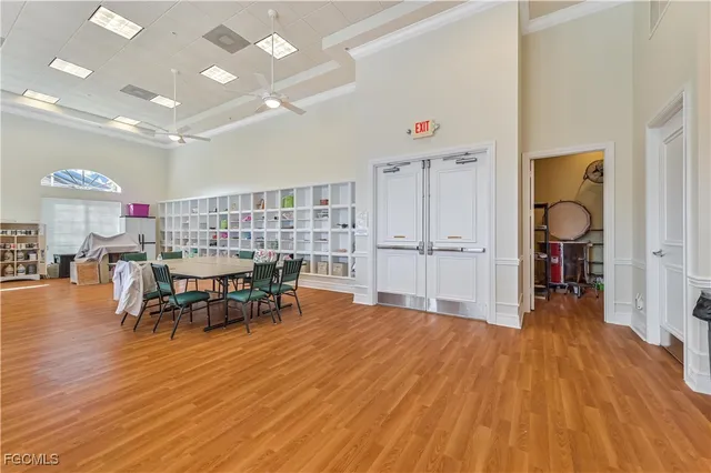 a view of a room with furniture and wooden floor