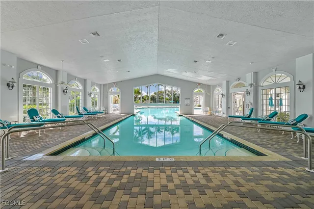 a room with lots of furniture and a large window